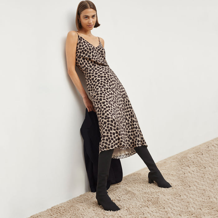 Side image of a woman wearing the orchard skirt in sahara print