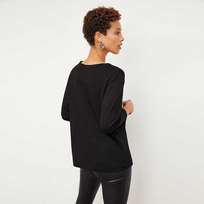 Back image of a woman wearing the Owen T-Shirt in Black