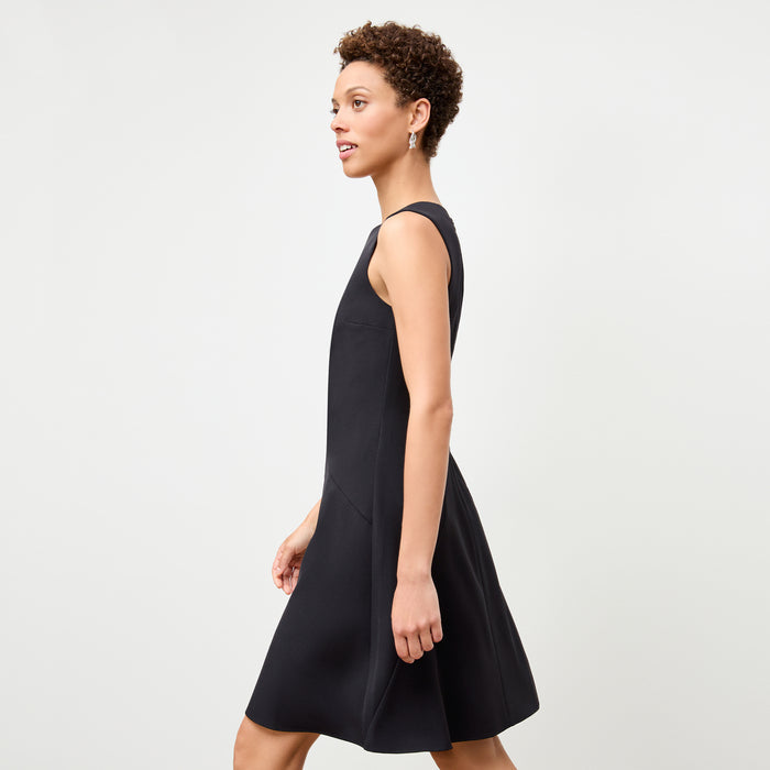 side image of a woman wearing the pauline dress in black