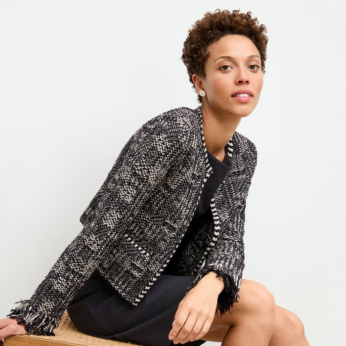 front image of a woman wearing the pauline dress in black