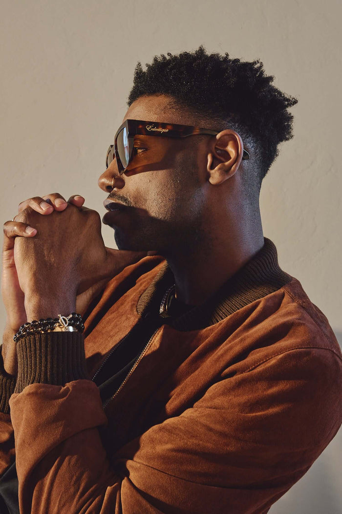 Model wearing Éclectique polarized tortoise sunglasses