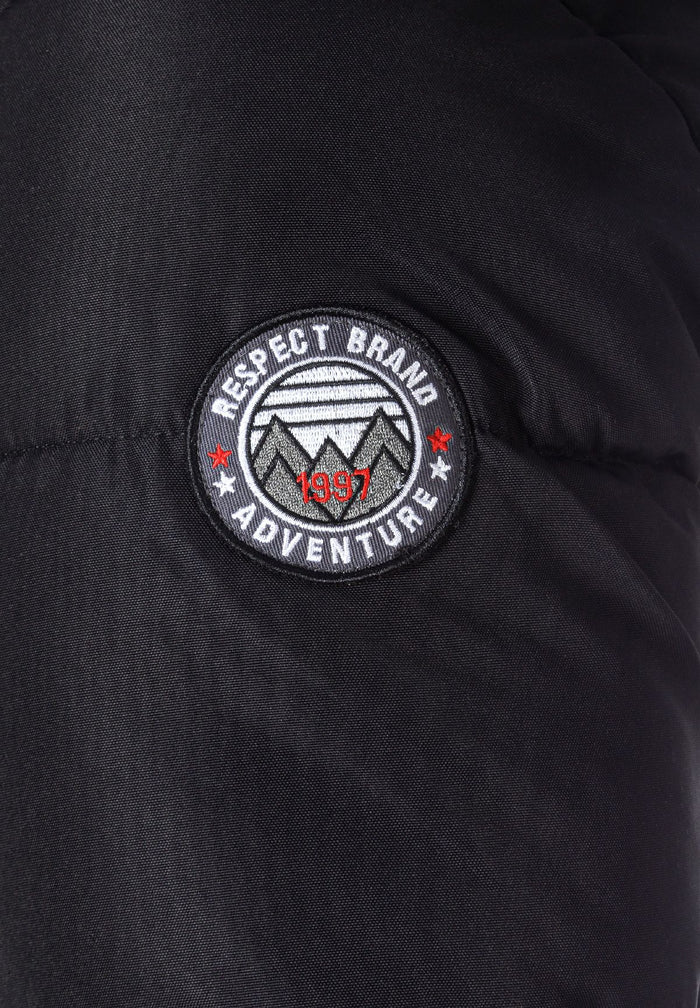 Detail of a black padded jacket sleeve with a logo badge.