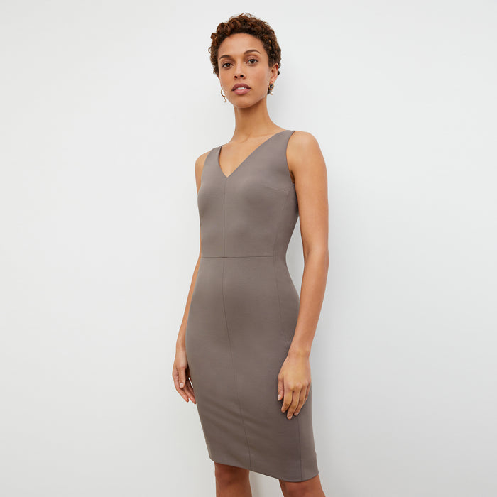 Side image of a woman wearing the Rachel dress in Pebble
