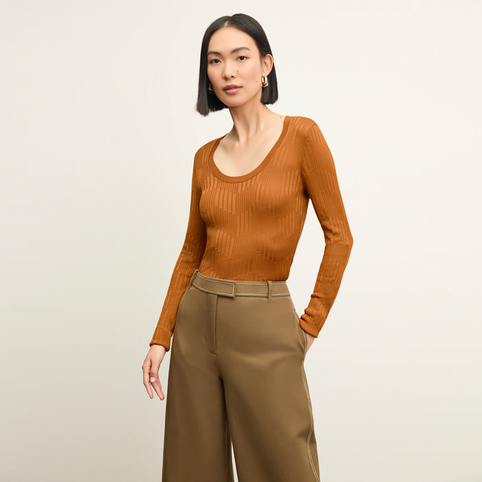 front image of a woman wearing the rae top in caramel | Lead