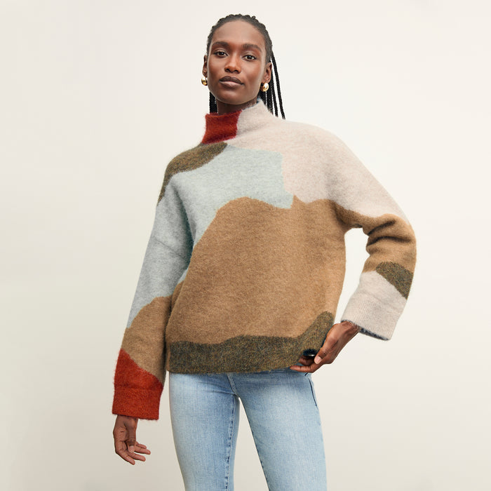 front image of a woman wearing the rajni sweater in multi | Lead