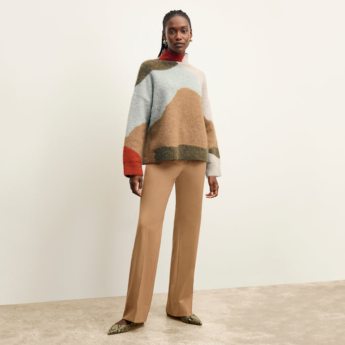 front image of a woman wearing the rajni sweater in multi
