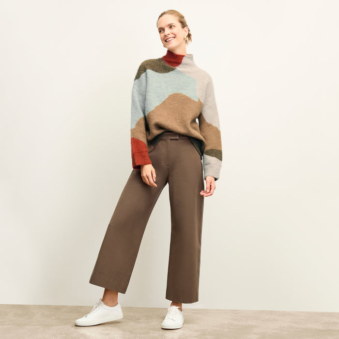 front image of a woman wearing the rajni sweater in multi