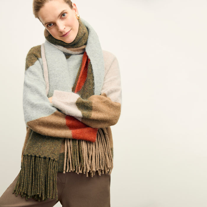 front image of a woman wearing the rajni sweater in multi