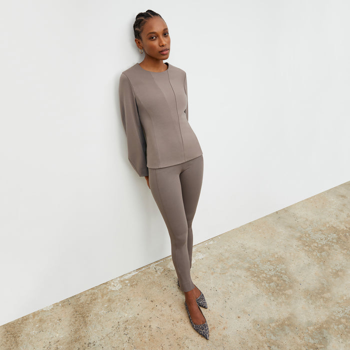 Front image of a woman wearing the Rashida top in Pebble | Lead