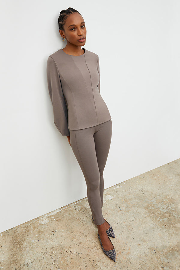 Front image of a woman wearing the Rashida top in Pebble | Exclude | Grid