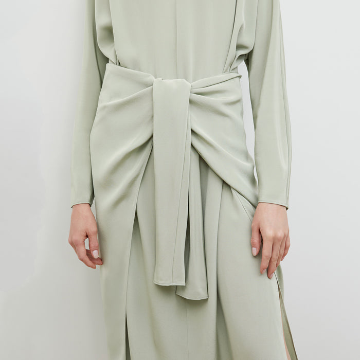 Front image of a woman wearing the Rashmeen dress in Minty Green