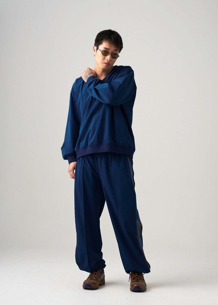 Model wearing the reversible windbreaker jacket styled for everyday city wear.