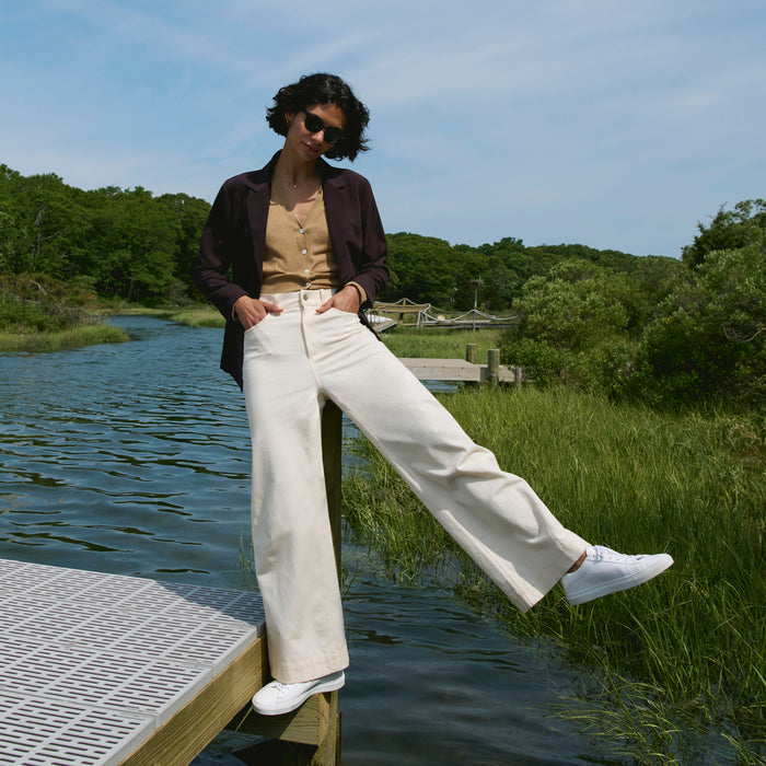 image of a woman wearing the delphine top in camel