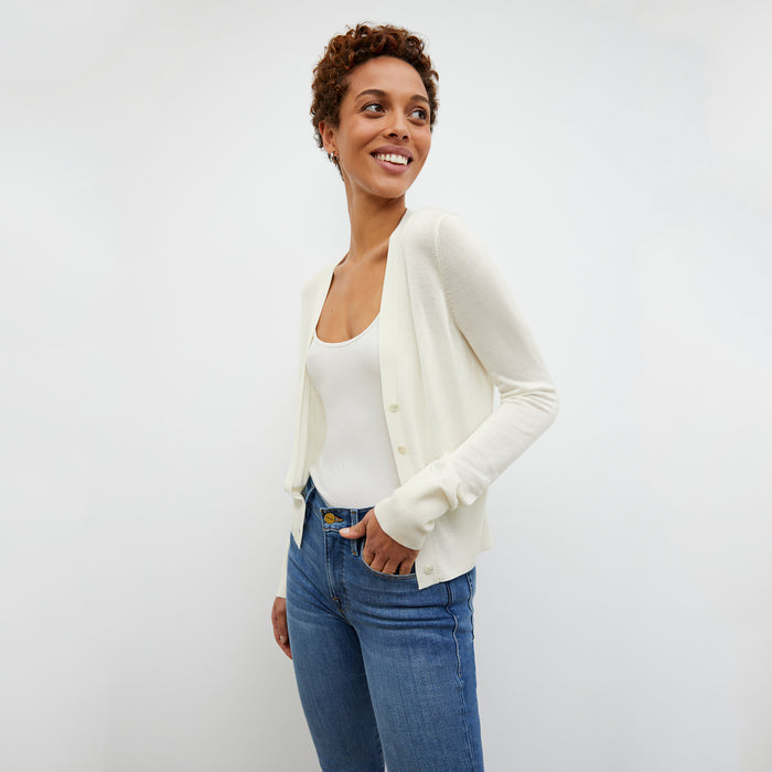 Side image of a woman wearing the Rory Cardigan - Silk Jersey in Ivory
