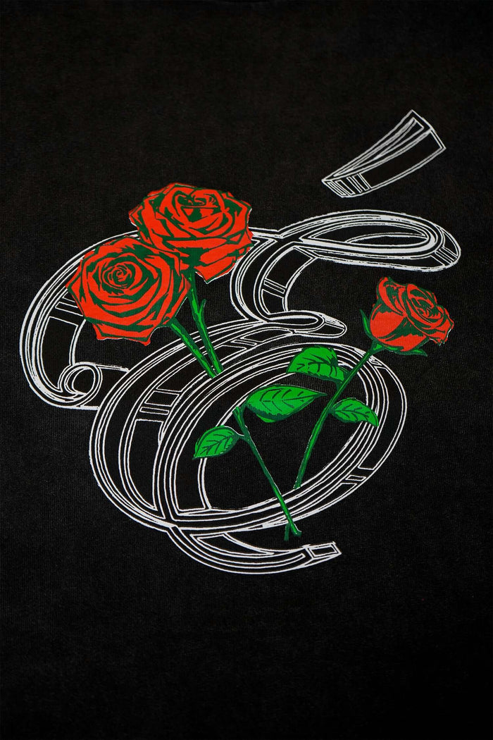 Éclectique Rose Graphic T-Shirt featuring three detailed red roses on a black background.