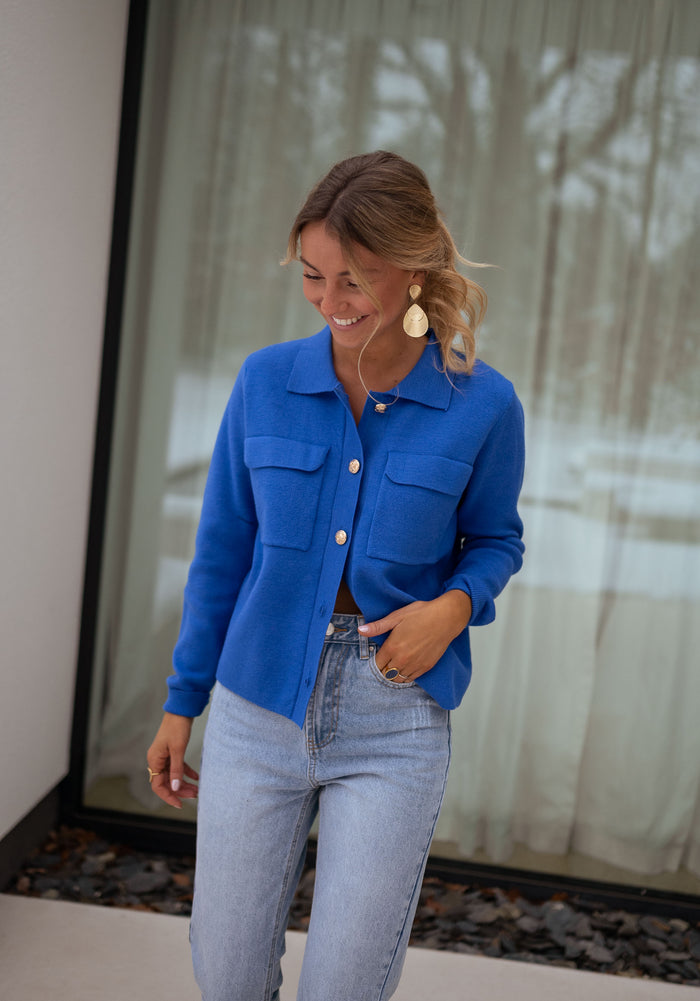 Model wearing royal blue Fika cardigan