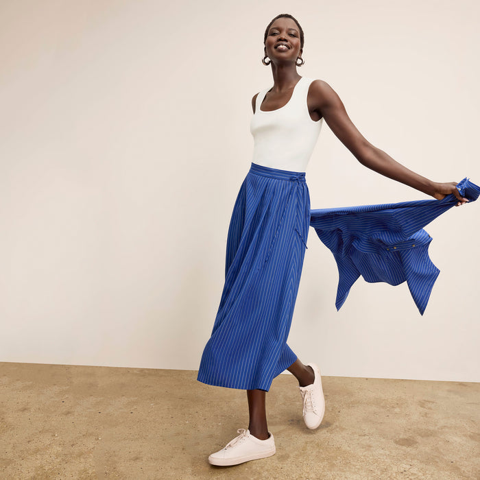 front image of a woman wearing the sabine top in ivory