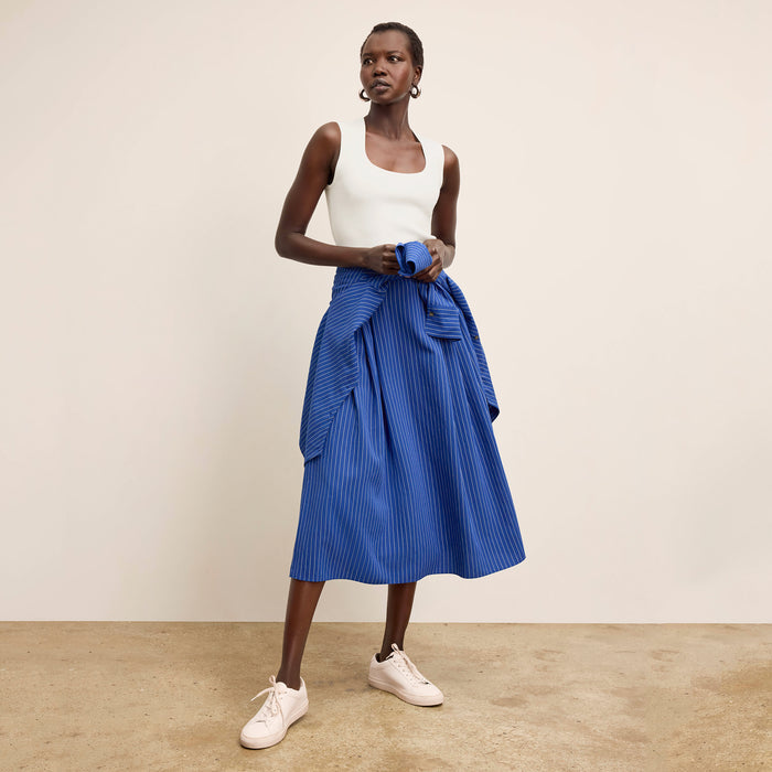 front image of a woman wearing the sabine top in ivory