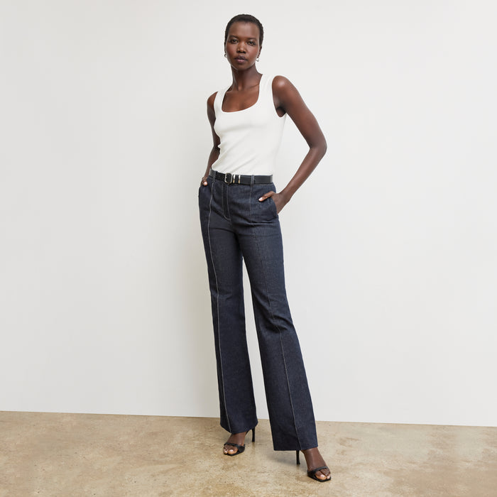 front image of a woman wearing the sabine top in ivory