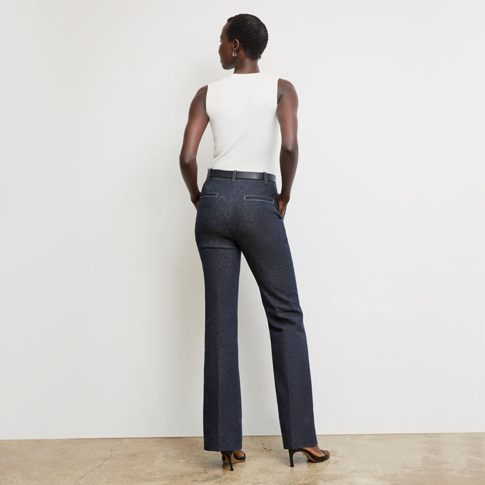 back image of a woman wearing the sabine top in ivory