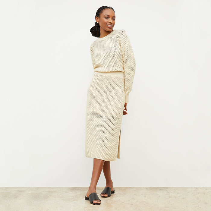 Front image of a woman wearing the Senga skirt in coconut