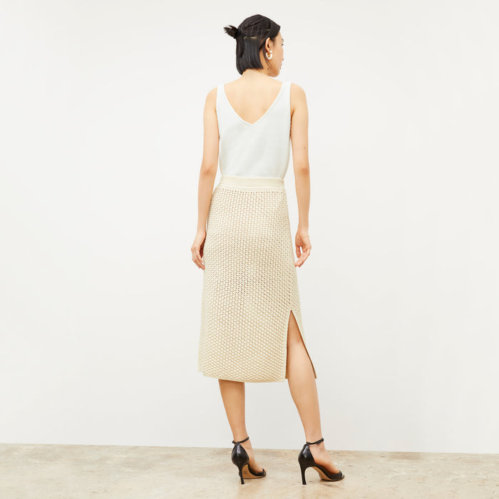 Front image of a woman wearing the Senga skirt in coconut