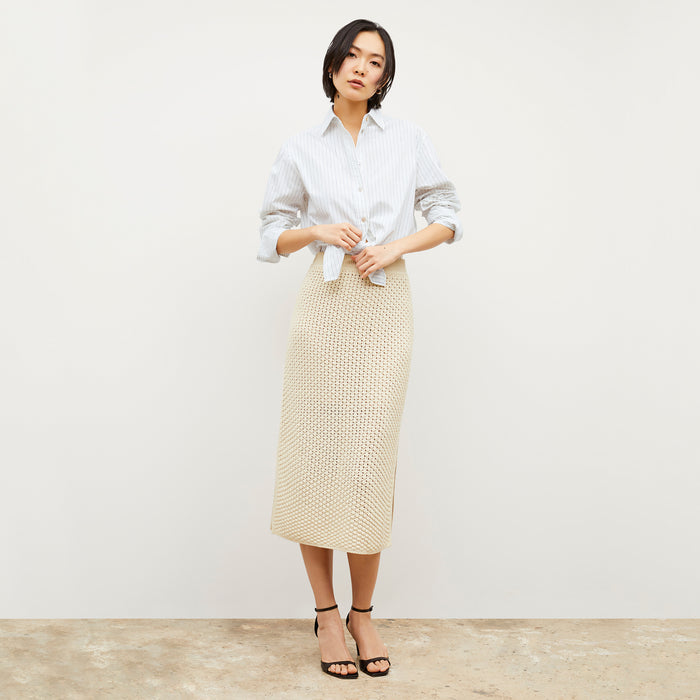 Front image of a woman wearing the Senga skirt in coconut