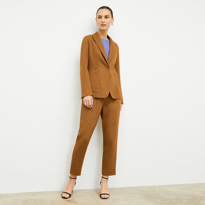 Front image of a woman wearing the Shane Pant in Acorn