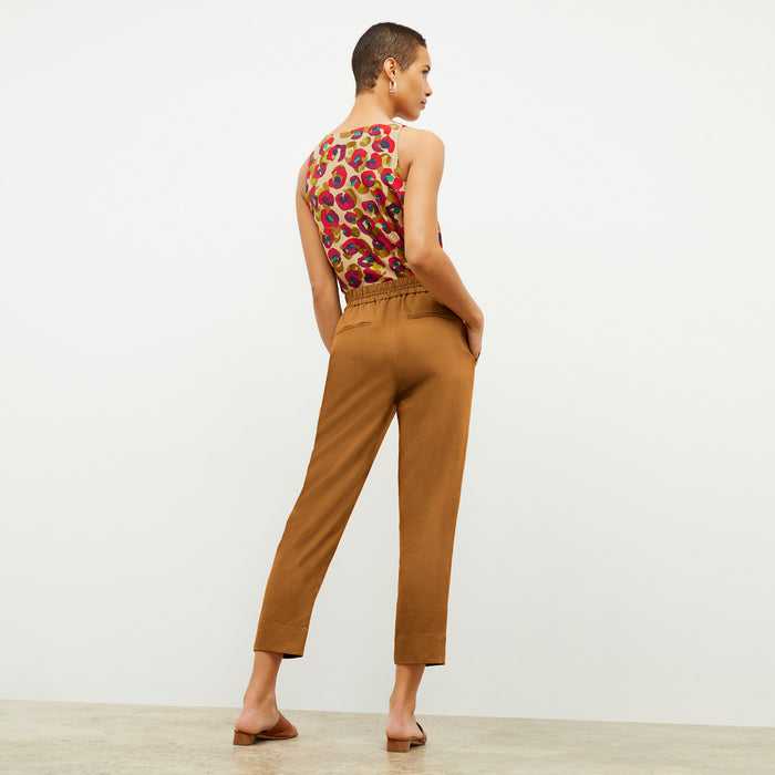 Back image of a woman wearing the Shane Pant in Acorn  | Exclude