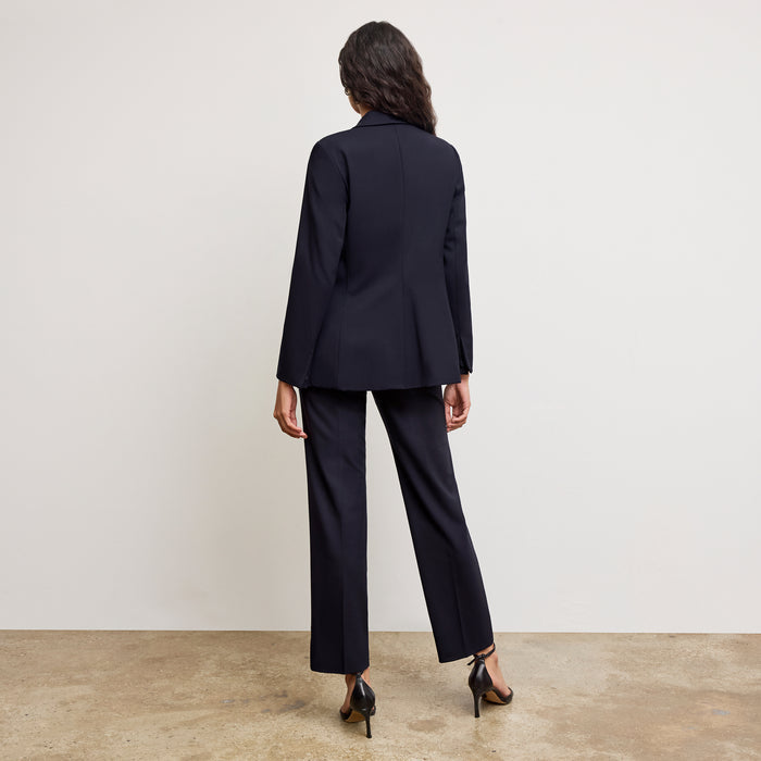 back image of a woman sitting wearing the yiyan petite blazer in galaxy blue  | Exclude