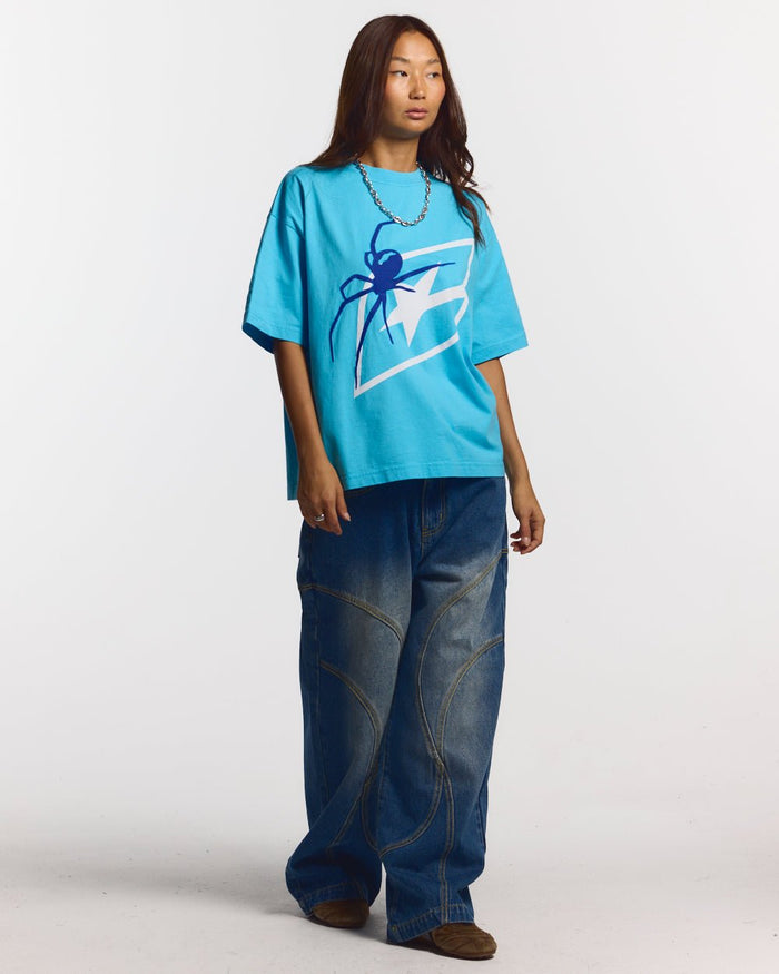 SPIDER TEE BLUE - blue graphic print tee, front view on female model - Cold Culture #woman