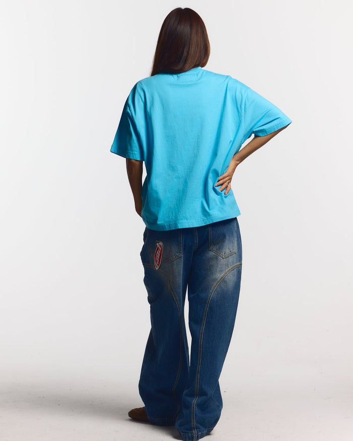 SPIDER TEE BLUE - blue graphic print tee, back view on female model - Cold Culture #woman
