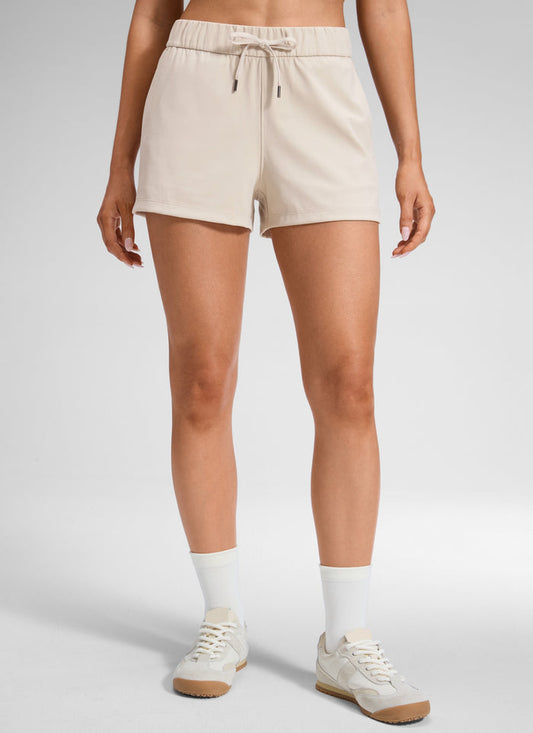 CRZ YOGA Women's Travel Stretch Mid-Rise Drawstring Shorts 2.5" Mojave Tan