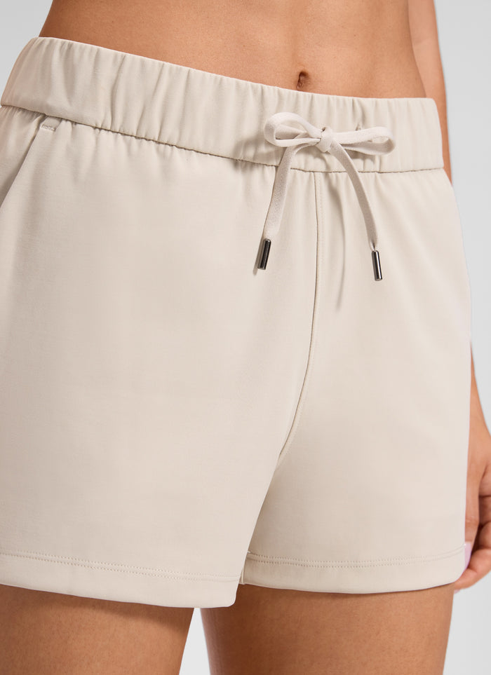 CRZ YOGA Women's Travel Stretch Mid-Rise Drawstring Shorts 2.5" Mojave Tan