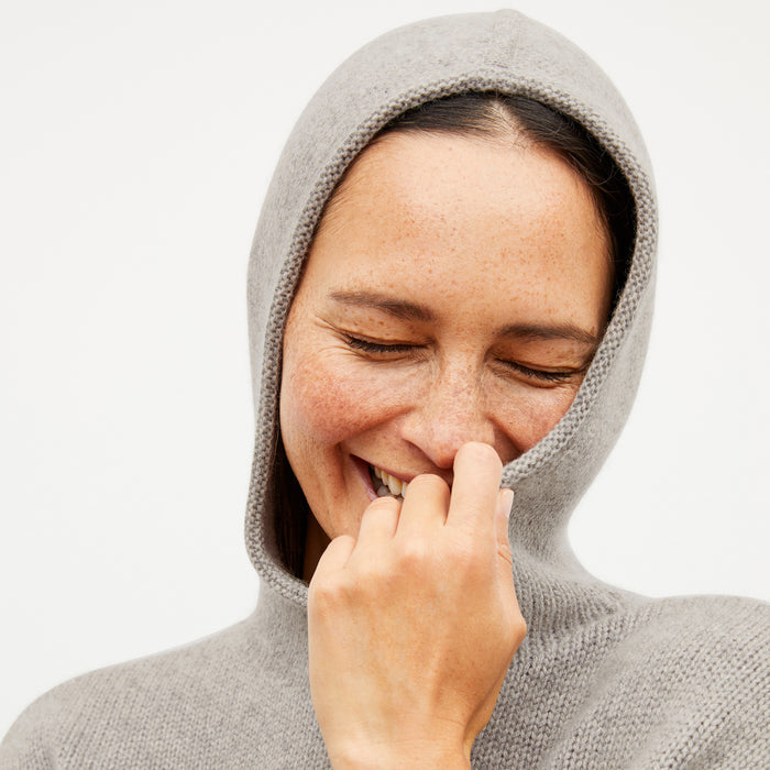 Front image of a woman wearing the thomas sweater in stormcloud