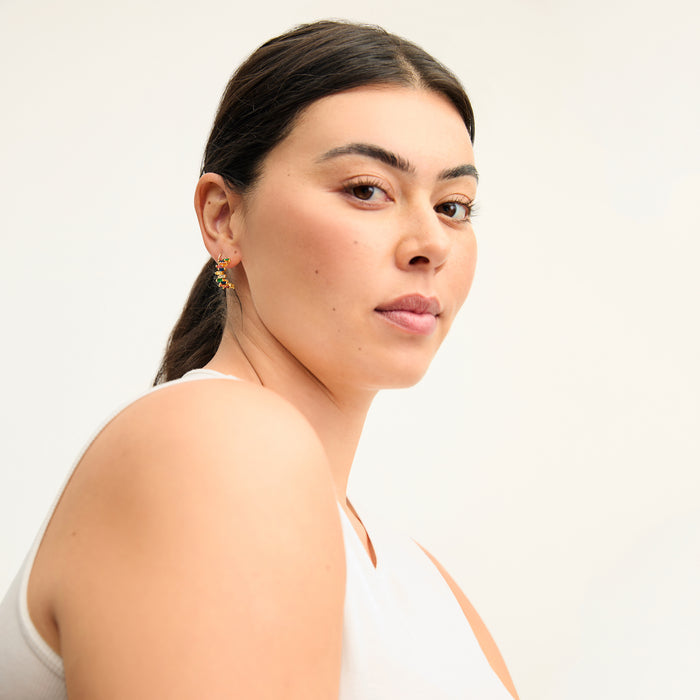 image of a woman wearing the tia earrings in multi