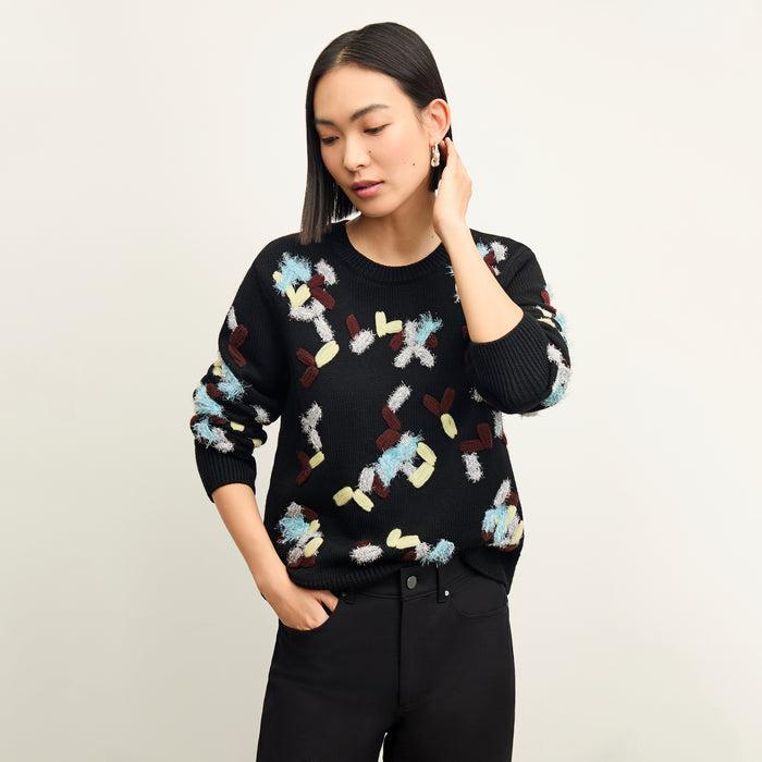 front image of a woman wearing the tish sweater in confetti | Lead