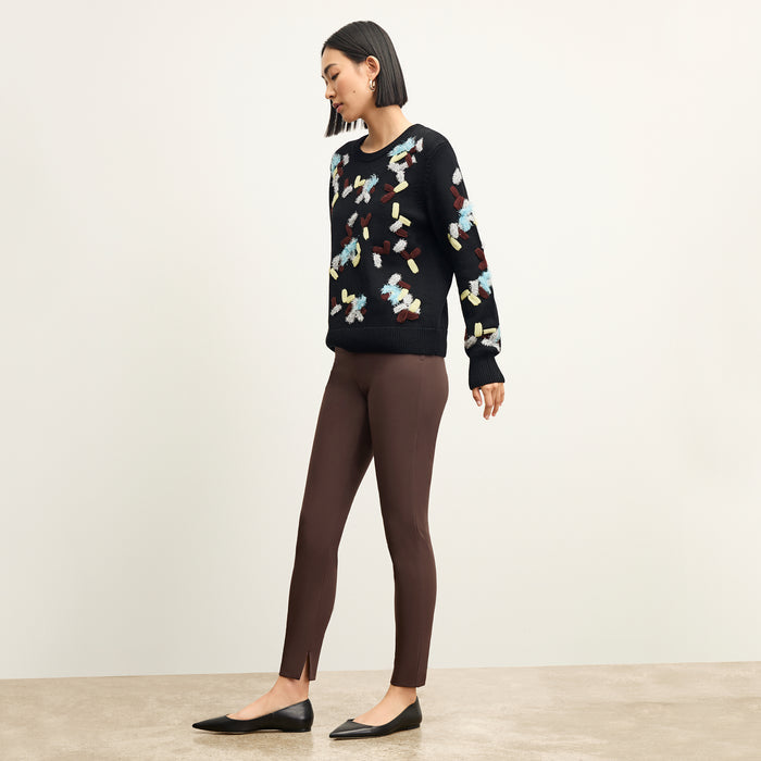 side image of a woman wearing the tish sweater in confetti