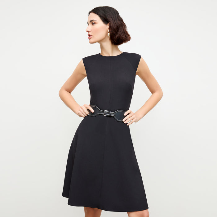 front image of a woman wearing the toi dress in black | Lead