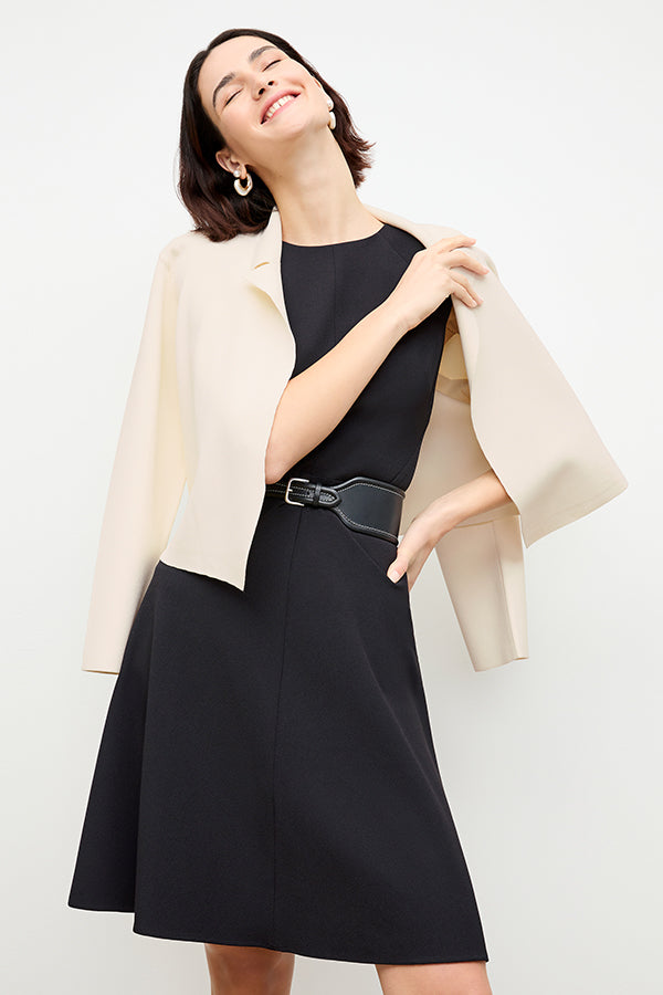 front image of a woman wearing the toi dress in black | Exclude