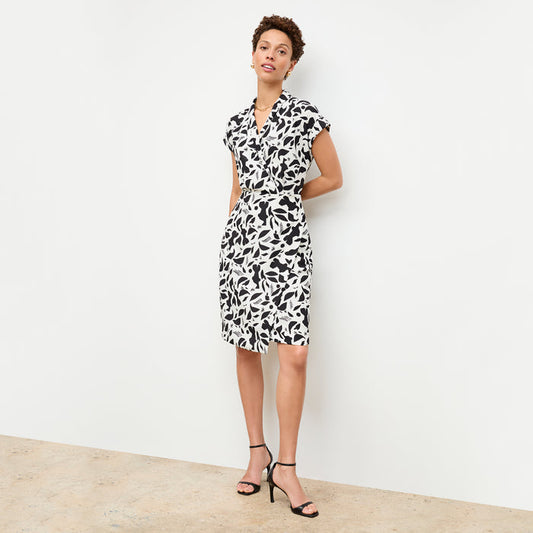 front image of a woman wearing the tory dress in icon print | Lead