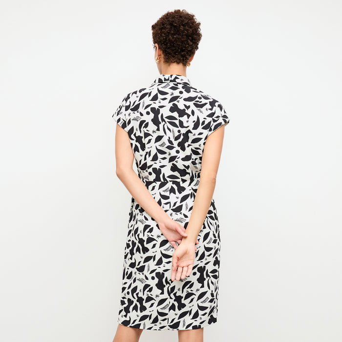 back image of a woman wearing the tory dress in icon print