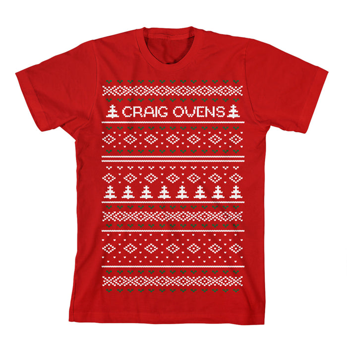 Red t-shirt with a festive knit-style design of trees, hearts, and diamonds, featuring the white Craig Owens logo across the chest.