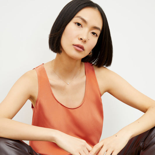 Front image of a woman wearing the Vicky Tank in Guava | Lead