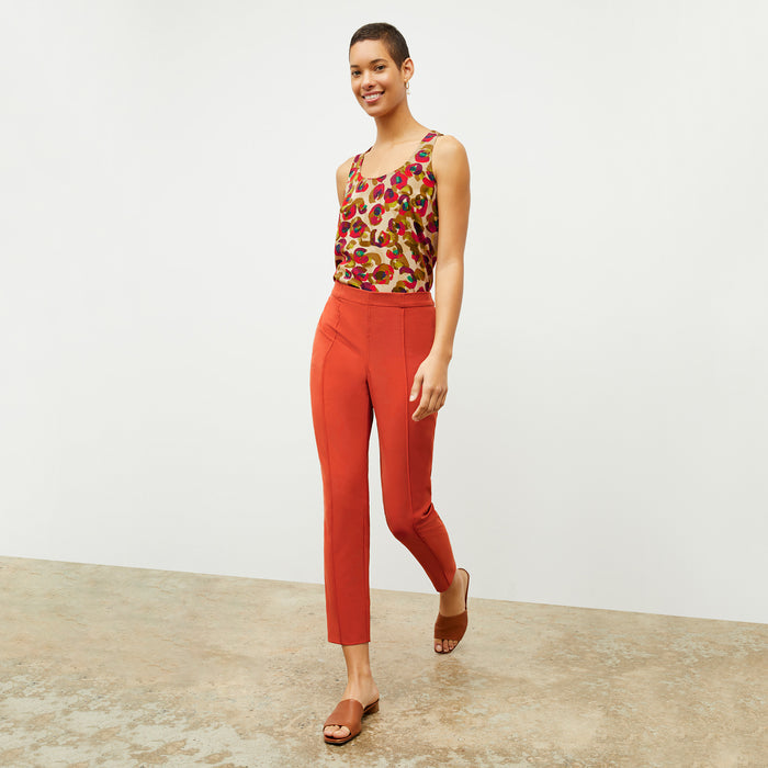 Front image of a woman wearing the Vicky Tank in Peacock Print