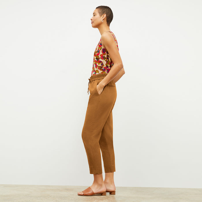 Side image of a woman wearing the Vicky Tank in Peacock Print