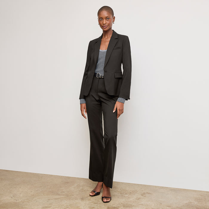 Front image of a woman wearing the Yiyan Blazer Short in Black