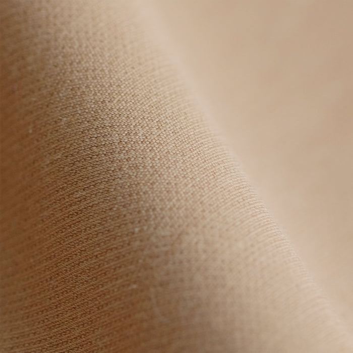 Close up image of wool twill fabric in camel